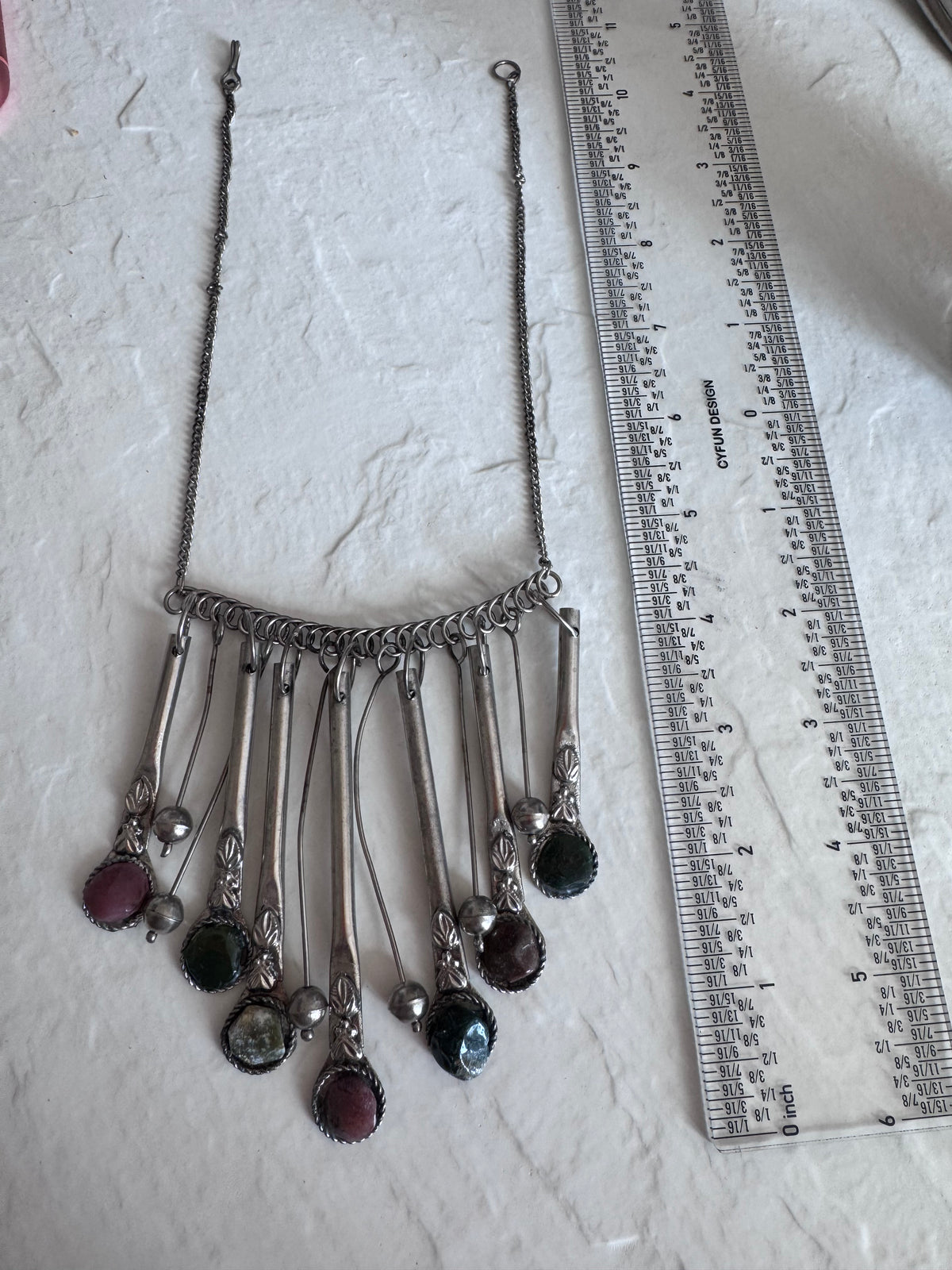 Estate vintage silver fringe necklace with multiple natural stones in purple green and brown tones showing bohemian statement jewelry design