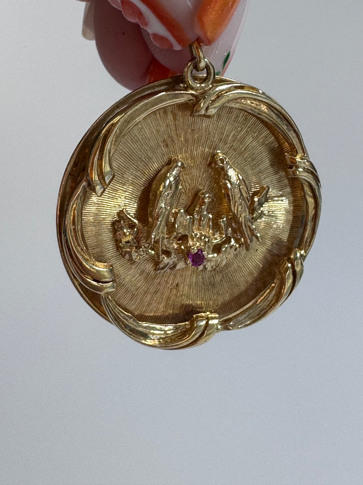 1950s 14K gold love birds medallion pendant with engine turned background and ruby accent, vintage romantic jewelry