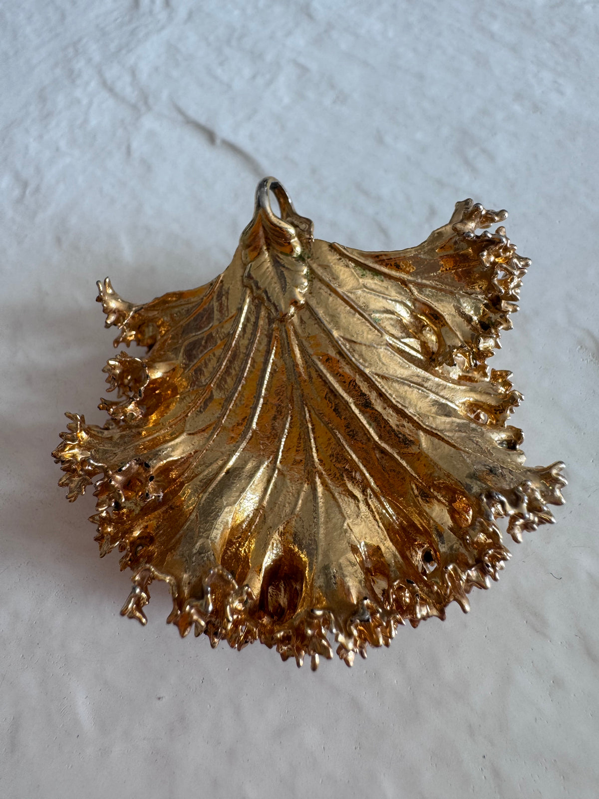 Estate 24K gold dipped natural kale leaf pendant showing detailed botanical texture with ruffled edges and natural veining