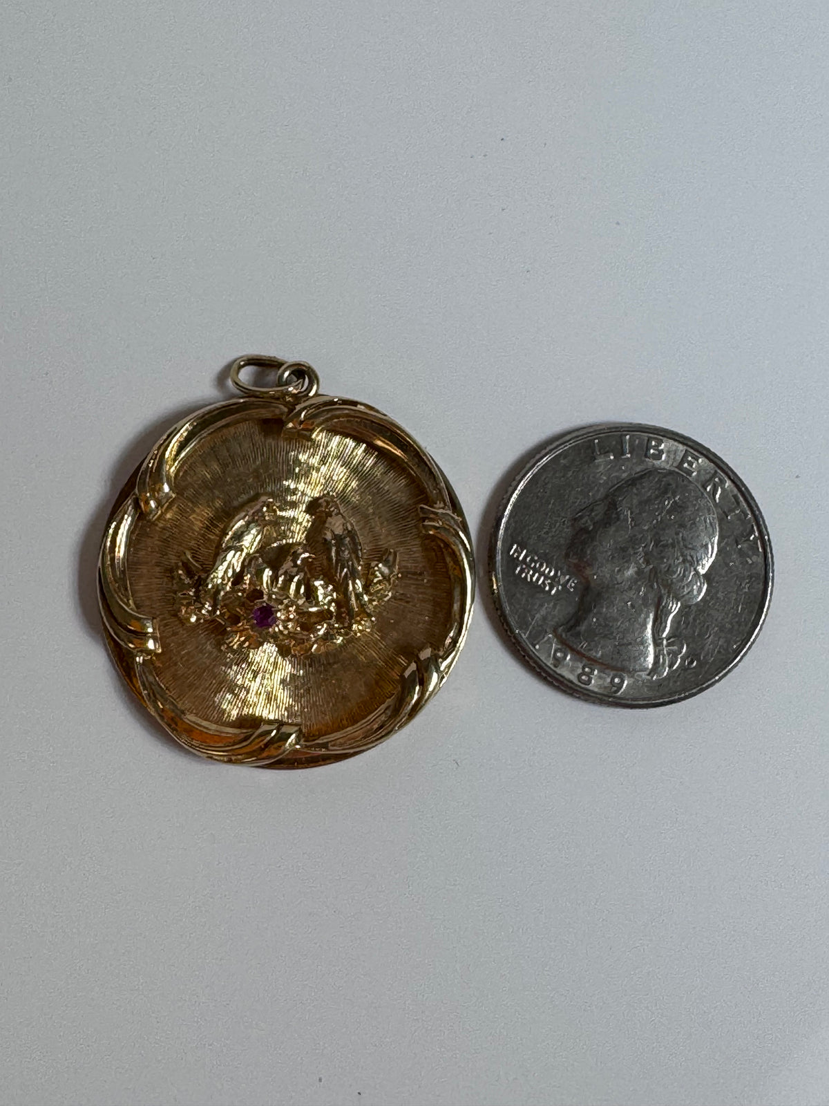 1950s 14K gold love birds medallion pendant with engine turned background and ruby accent, vintage romantic jewelry