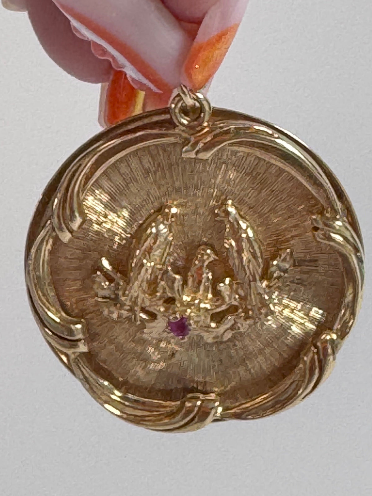 1950s 14K gold love birds medallion pendant with engine turned background and ruby accent, vintage romantic jewelry