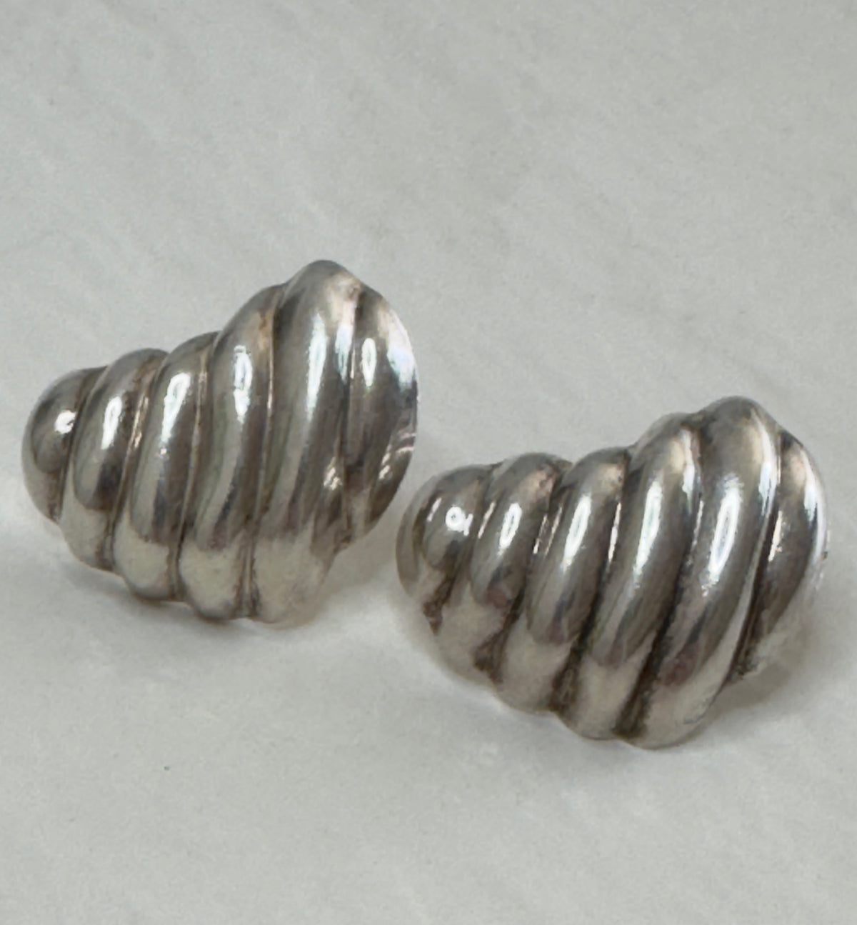 Vintage Mexican sterling silver ribbed puffy heart earrings with dimensional swirl pattern and high polish finish