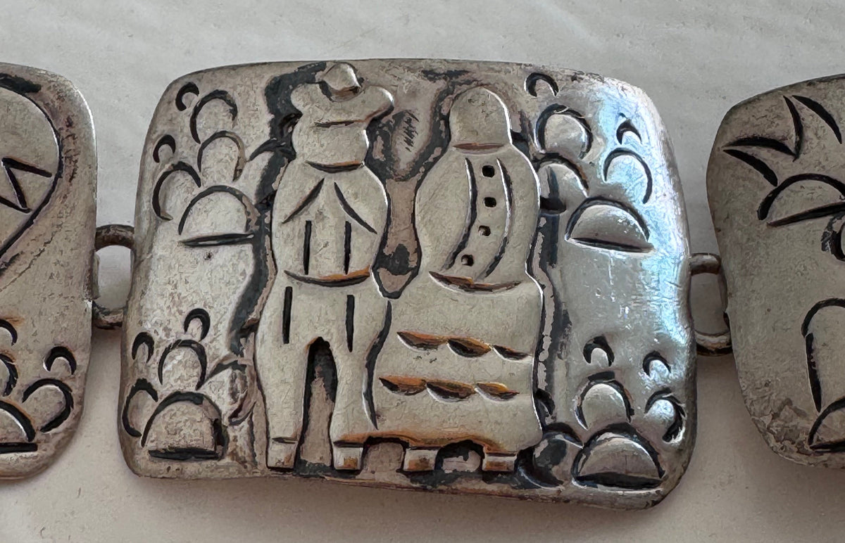 Estate J. Alvarez Taxco Mexican sterling silver storyteller panel bracelet showing detailed cultural scenes with guitar player, pottery, and folk motifs