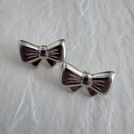 Vintage sterling silver bow earrings with detailed fabric texturing, 925 hallmark and mystery maker's mark, perfect for rockabilly pin-up style