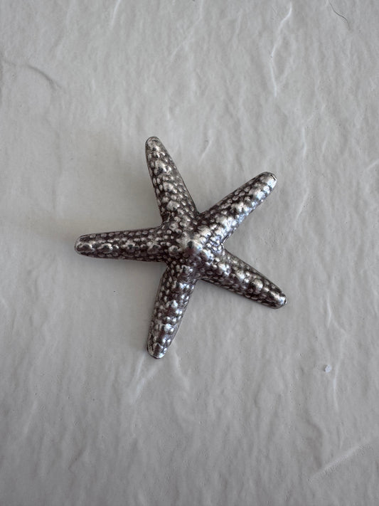 Large Karen Hill Tribe silver starfish pendants with textured surface showing authentic handcrafted details and hidden bail construction