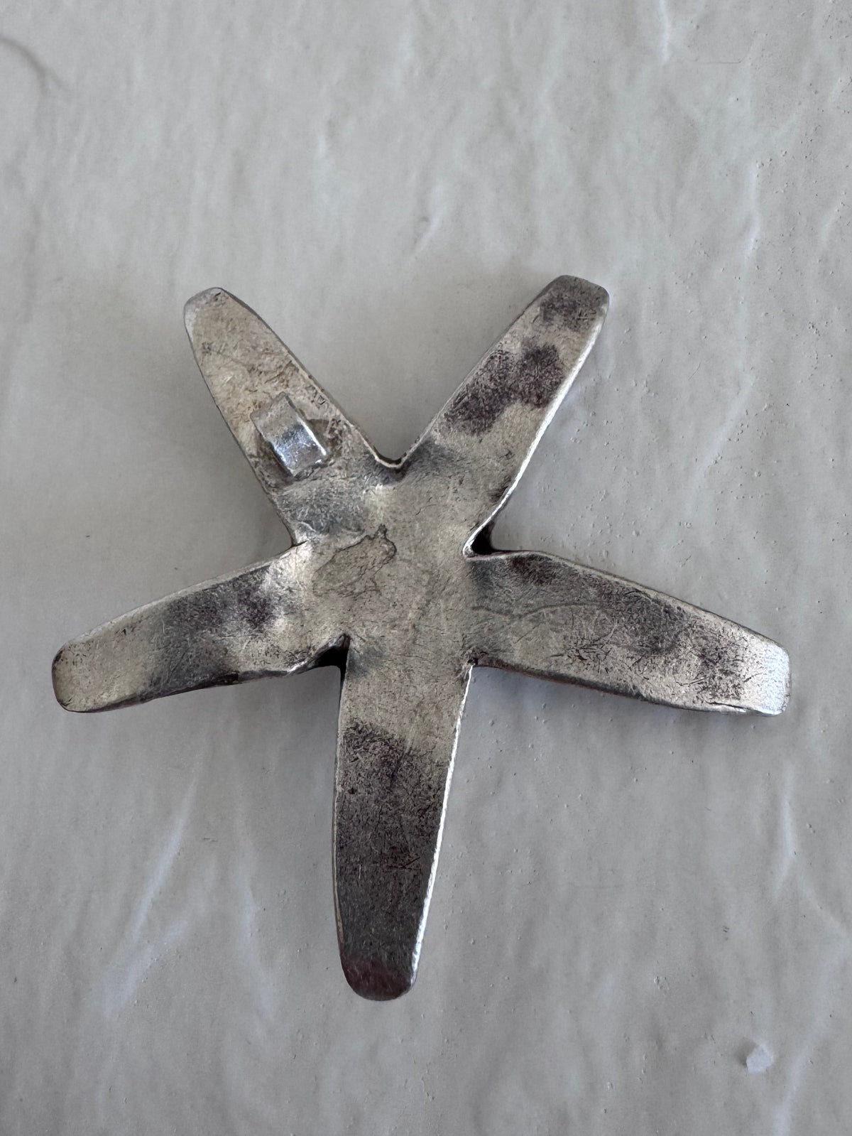 Large Karen Hill Tribe silver starfish pendants with textured surface showing authentic handcrafted details and hidden bail construction