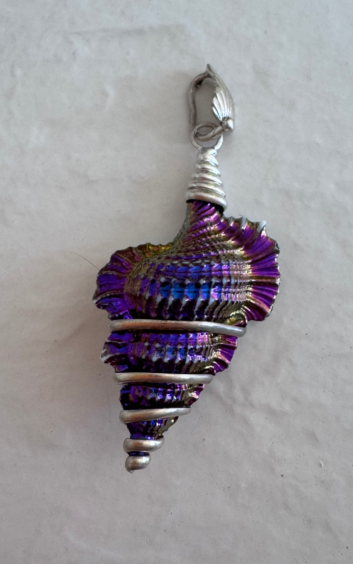 Estate sterling silver wire wrapped shell pendants with rainbow chrome iridescent finish showing purple blue and gold colors, approximately 2 inches long