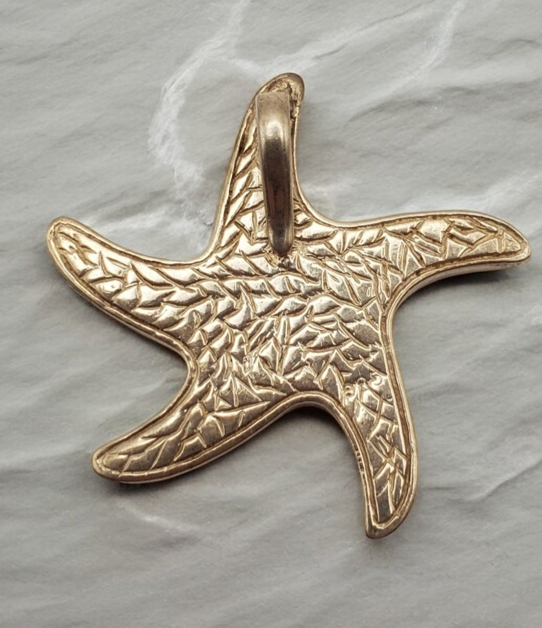 
Vintage sterling silver starfish pendant with mother of pearl and green resin mosaic inlay, showing detailed craftsmanship and 925 hallmark