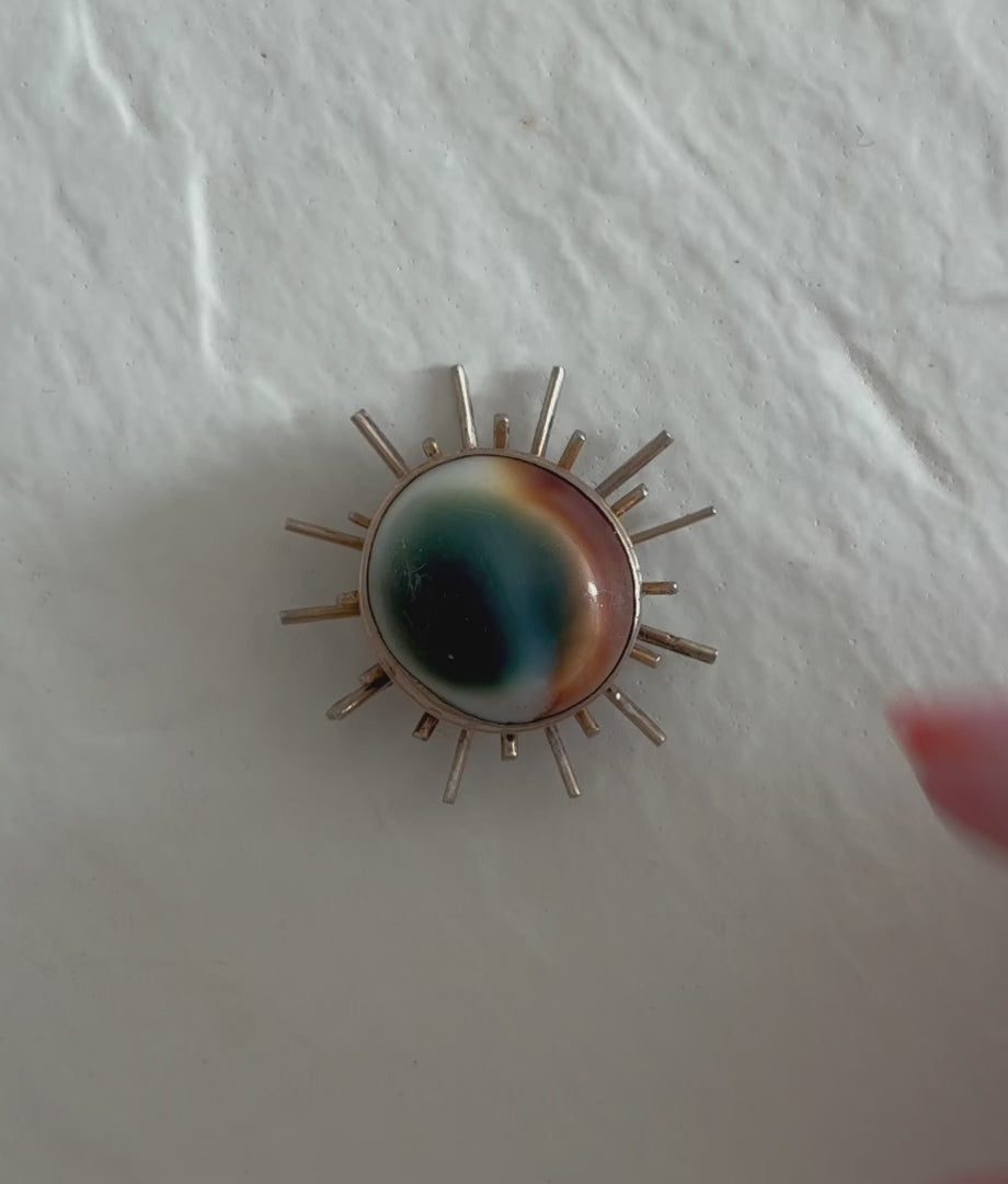 1940s sterling silver sunburst pendant with natural operculum center, WWII era modernist design with gold wash